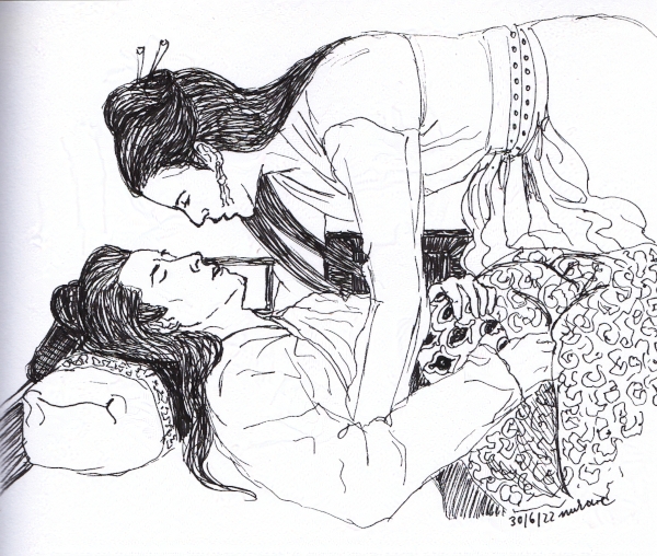 woman leaning over a prone man